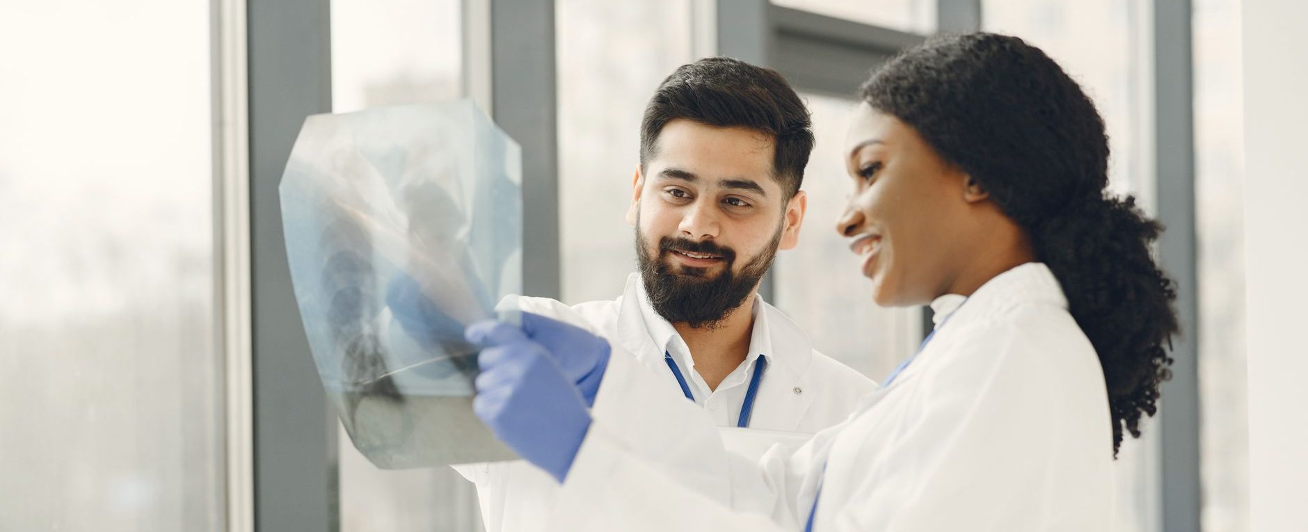 two doctors examining an x ray image